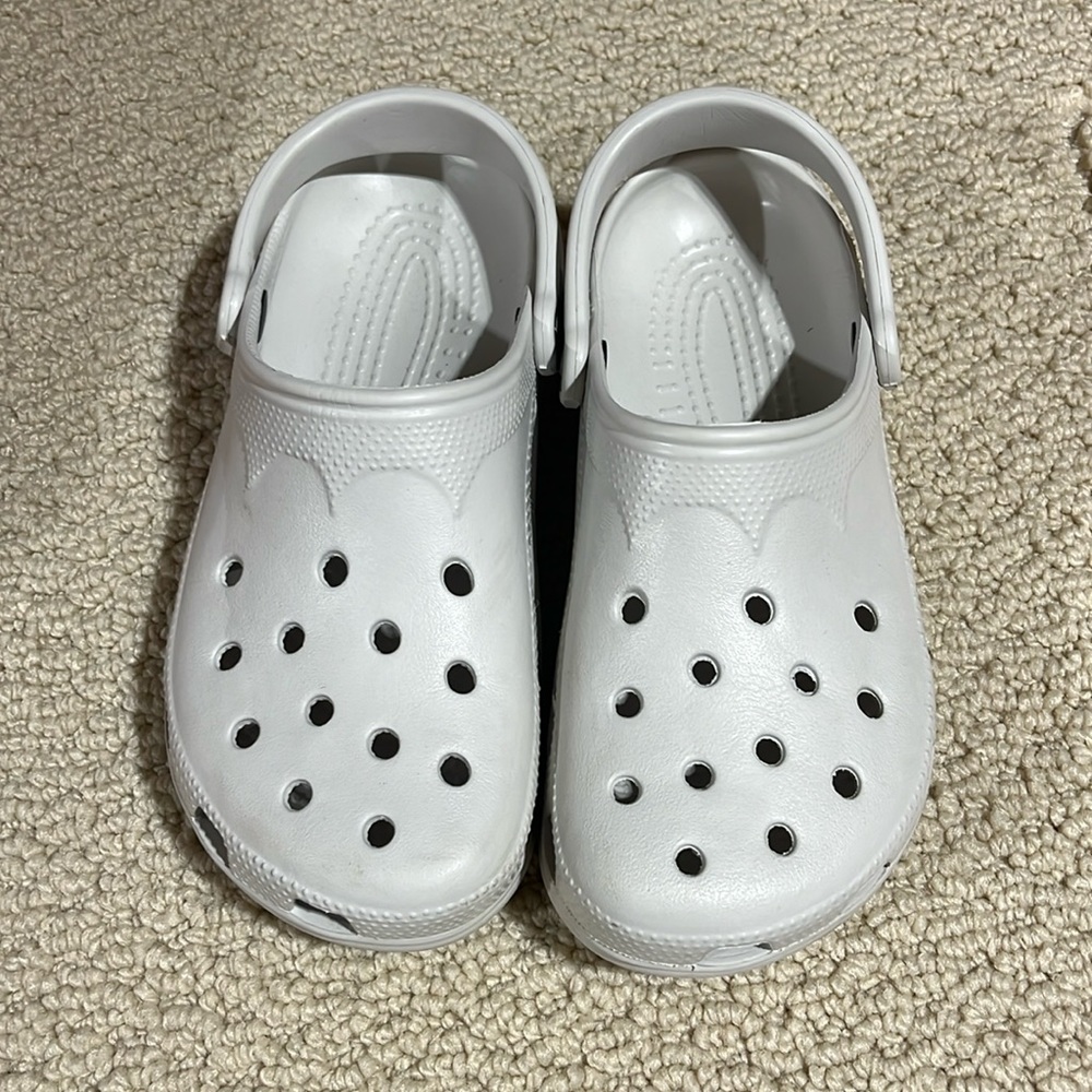 Light Lavender Crocs—notice two different sized shoes